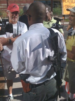 Black man armed with a AR-15 and Glock handgun at Obama protest in Phoenix